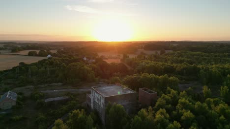 drone shoot flying towards the sunrise over an abandoned coal mining shaft in kent uk