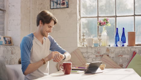 young student using smart watch at home in  morning drinking coffee