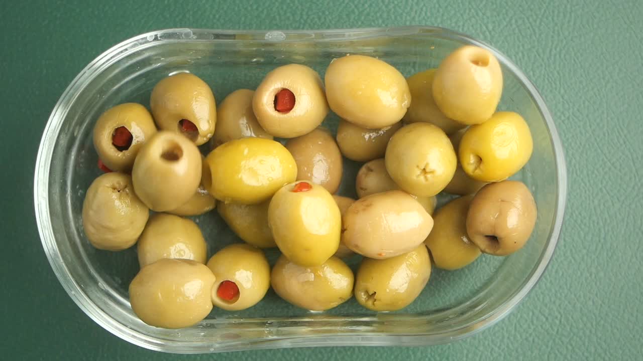 Stuffed Green Olives in a Glass Bowl