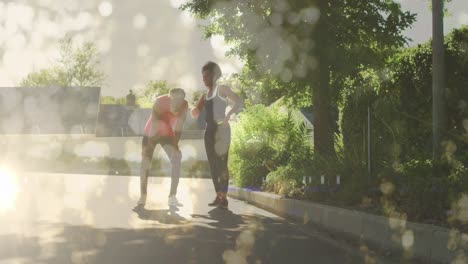 animation of light spots over african american couple running, slow motion