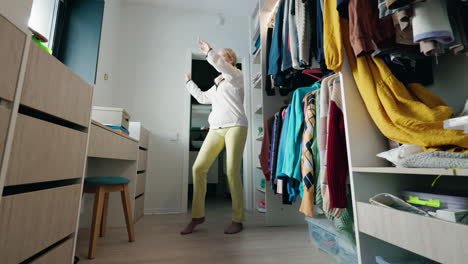 woman dancing in her closet