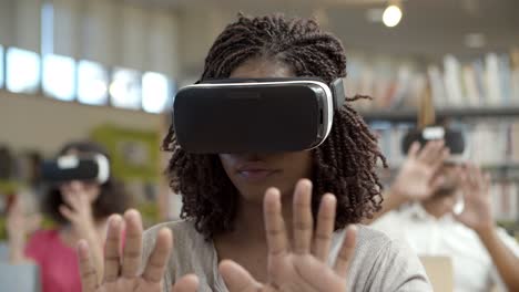 slow motion shot of focused woman wearing vr glasses