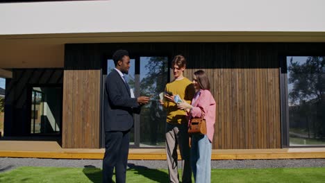 real estate agent showing a house to clients