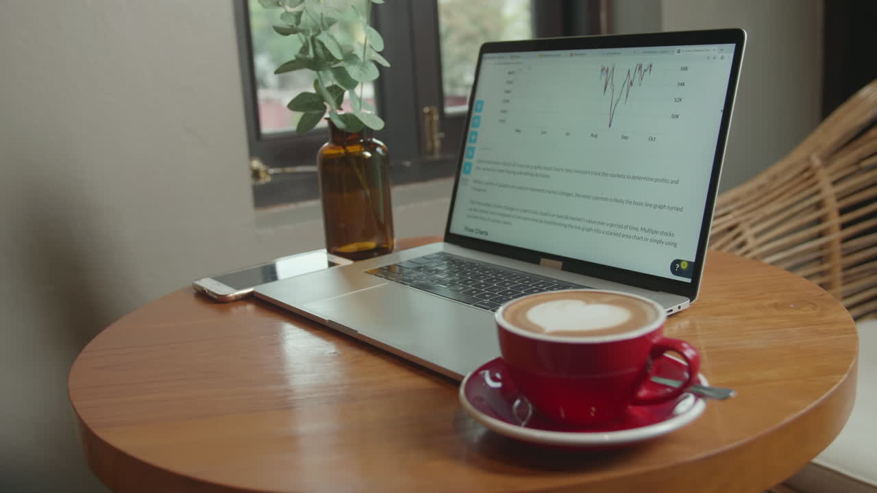Laptop With A Cup Of Coffee On The Table
