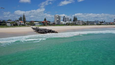 idyllic seascape of palm beach in gold coast, queensland, australia during summer - aerial pullback