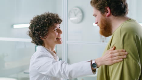 female doctor measuring waist of obese man