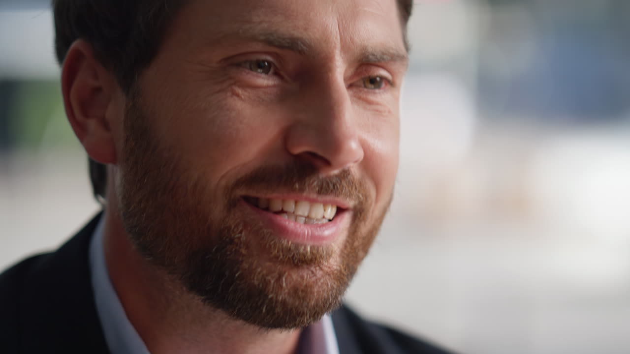 Closeup bearded man talking to unknown friend sitting urban cafe portrait