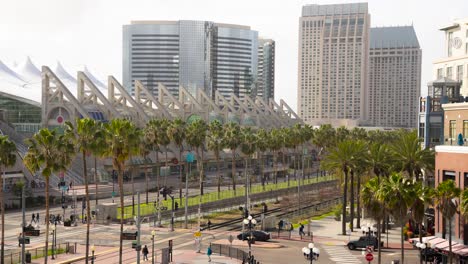 san diego convention center on a sunny day - time lapse of foot traffic, trains, and cars