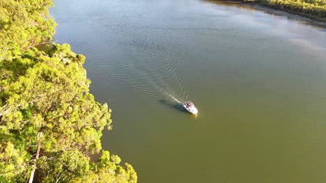 a boat travels along a scenic river