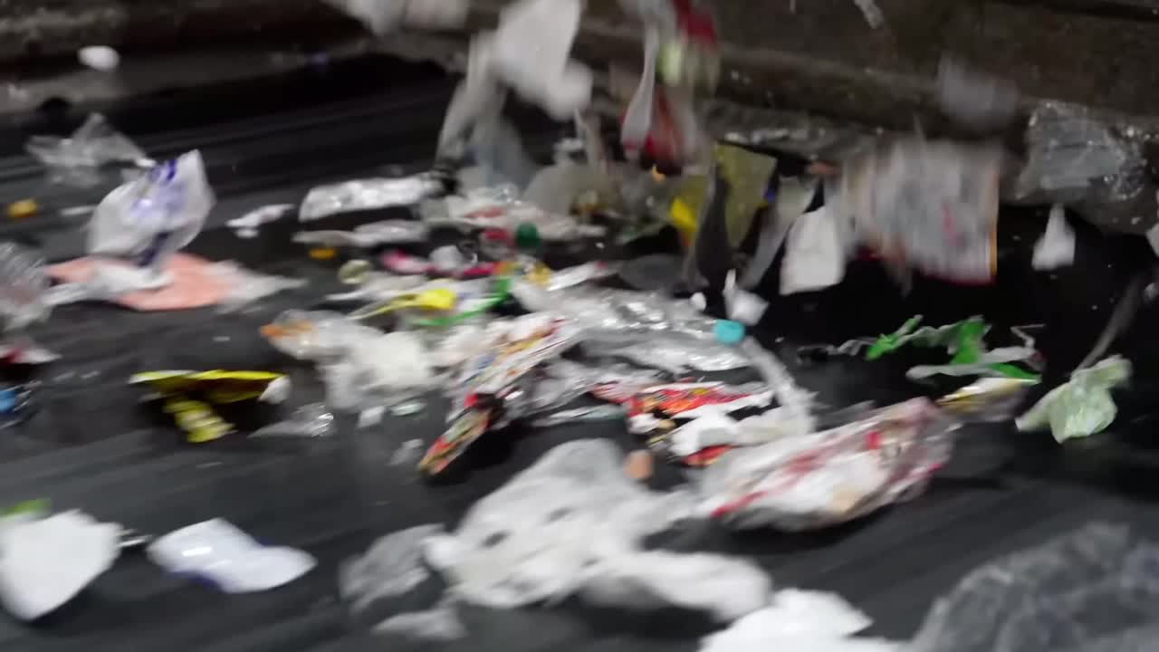Automated Waste Sorting: Mixed Materials on Conveyor.
