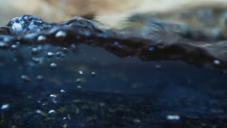 slow motion video of water waves with splashes and falling drops