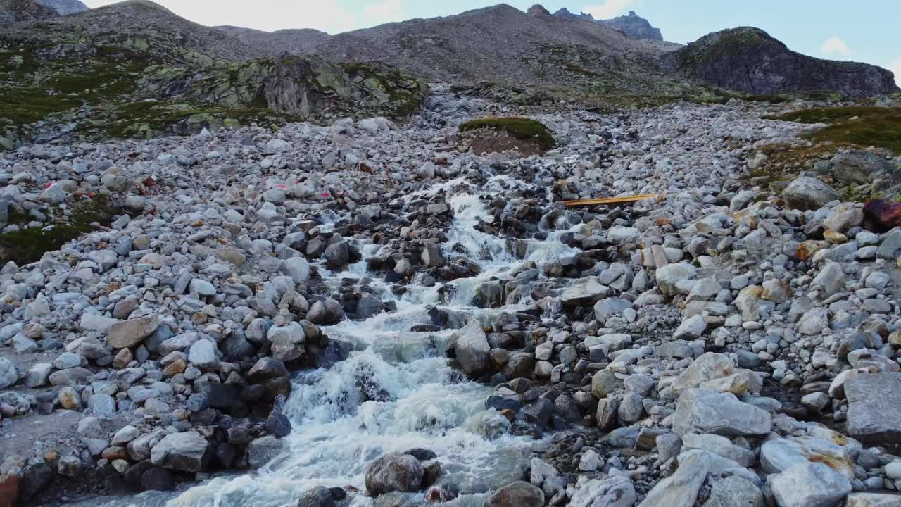 Drone shot of river flow to the "Schlegeis Stausee" or Schlegeis reservoir in Tirol, Austria