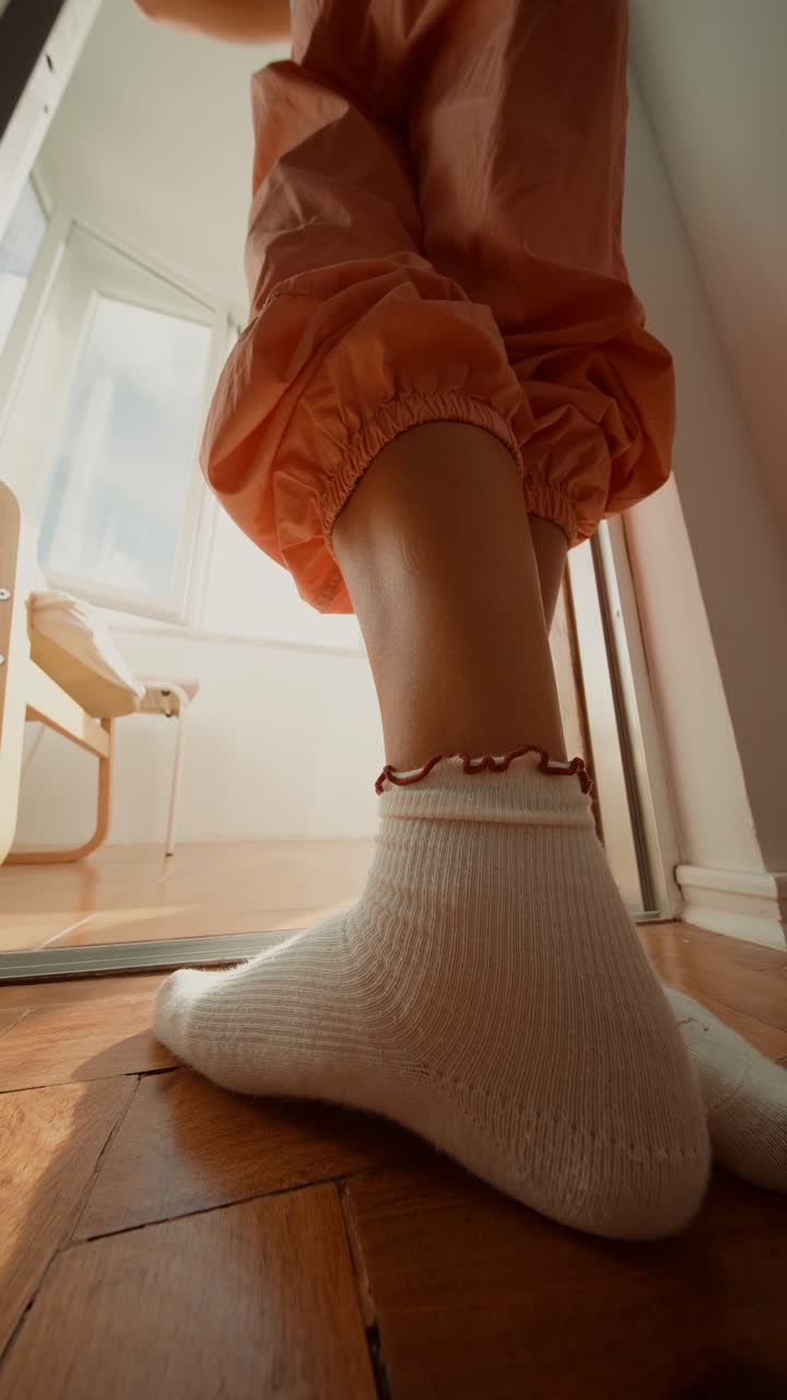 Close-up shot of a person's legs wearing socks