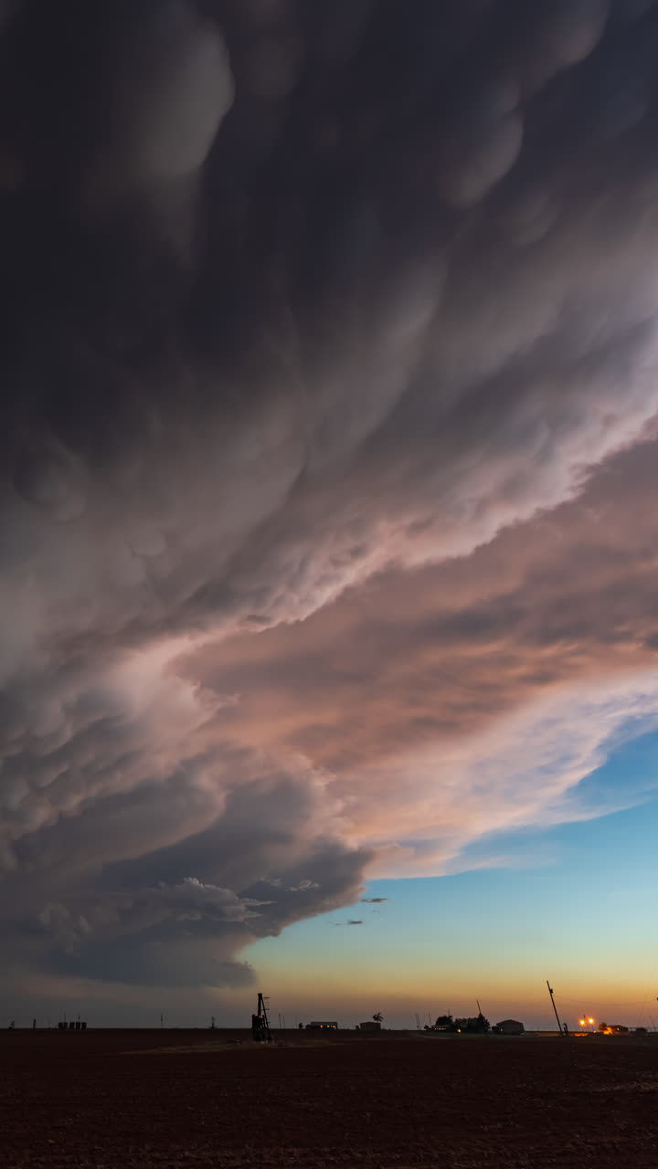 Sunset sky filled with gentle cloud motion and rich warm tones creating serene atmosphere