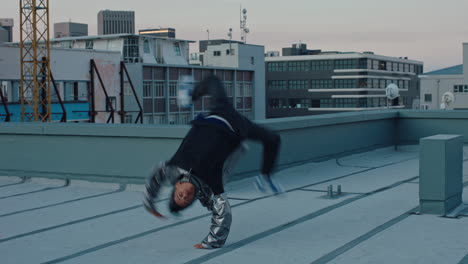 dancing-man-breakdancing-on-roof-top-hip-hop-dancer-practicing-dance-routine-performing-freestyle-moves-in-city