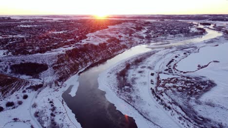 drone footage of calgary's community during a beautiful winter sunrise