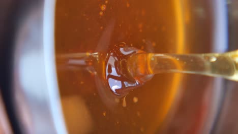 close-up of golden honey being poured