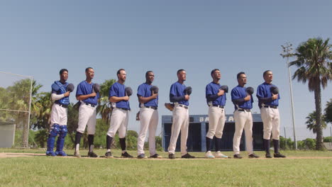 baseball players standing on line