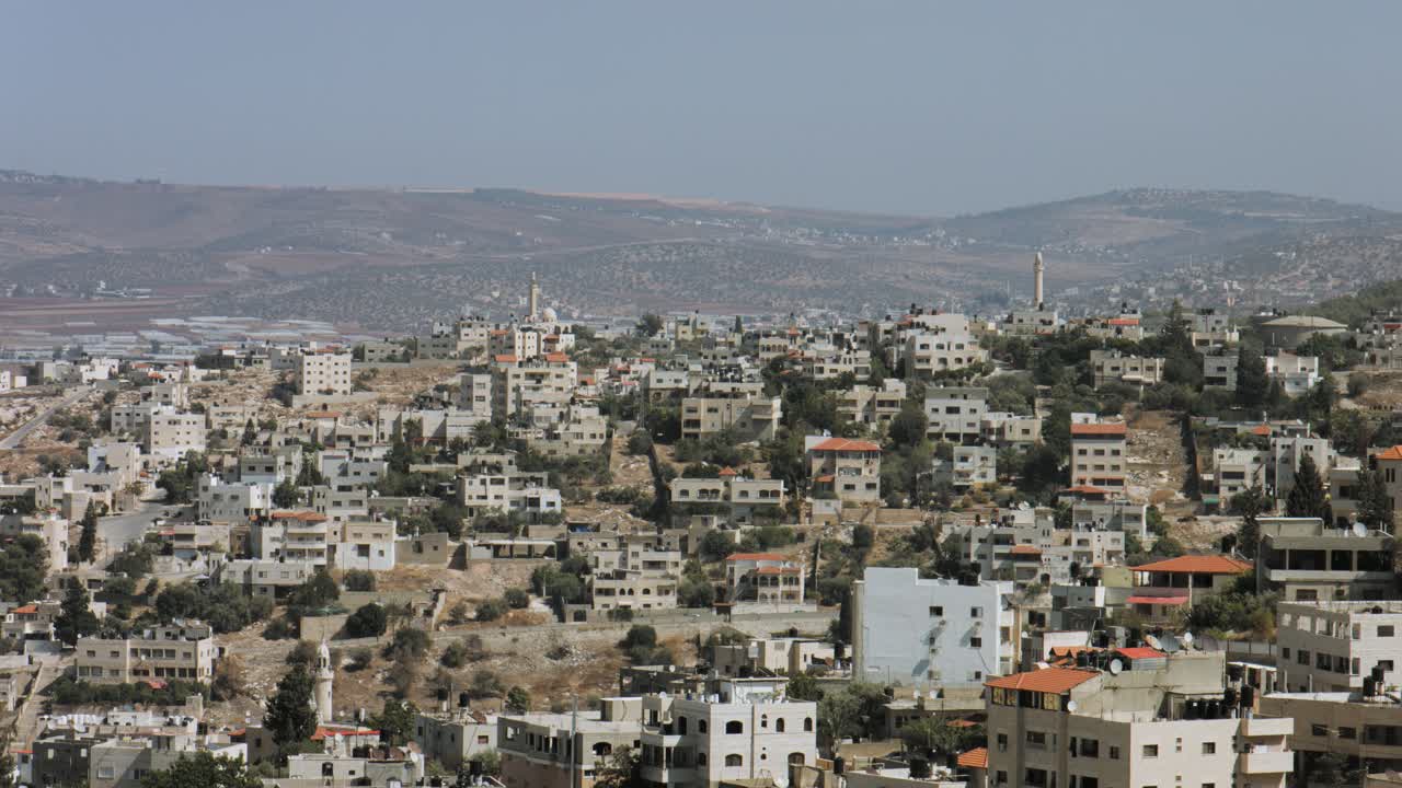 Jenin, Palestine, West Bank, long shot, Jenin houses, buildings on a hill, a Palestinian city in northern west bank. 4K footage