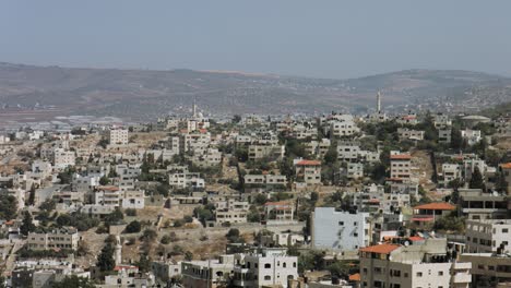 jenin, palestine, west bank, long shot, jenin houses, buildings on a hill, a palestinian city in northern west bank. 4k footage