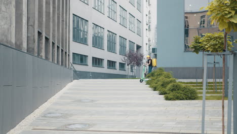 woman riding electric scooter in urban cityscape