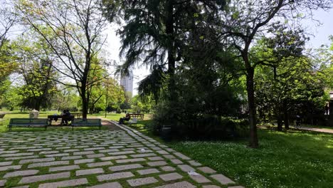 people enjoying a sunny day in milan park