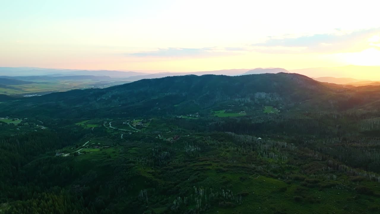 Sunset casting long shadows across hills and valleys in Steamboat Springs, natural panoramic backdrop