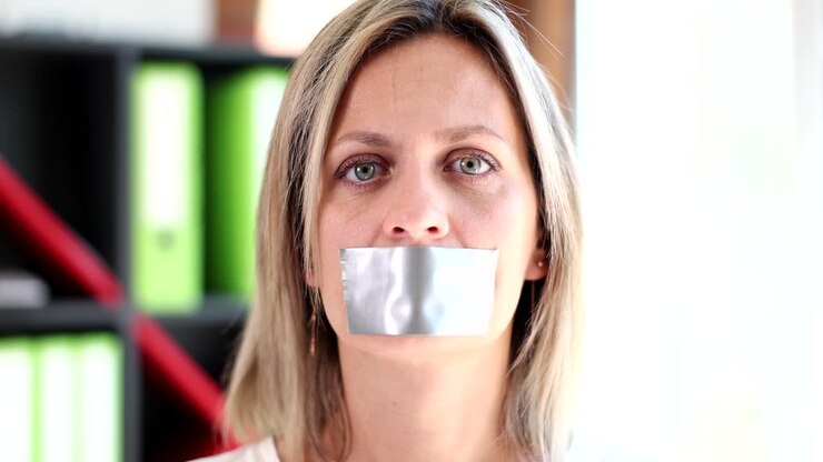 Woman with duct tape over her mouth