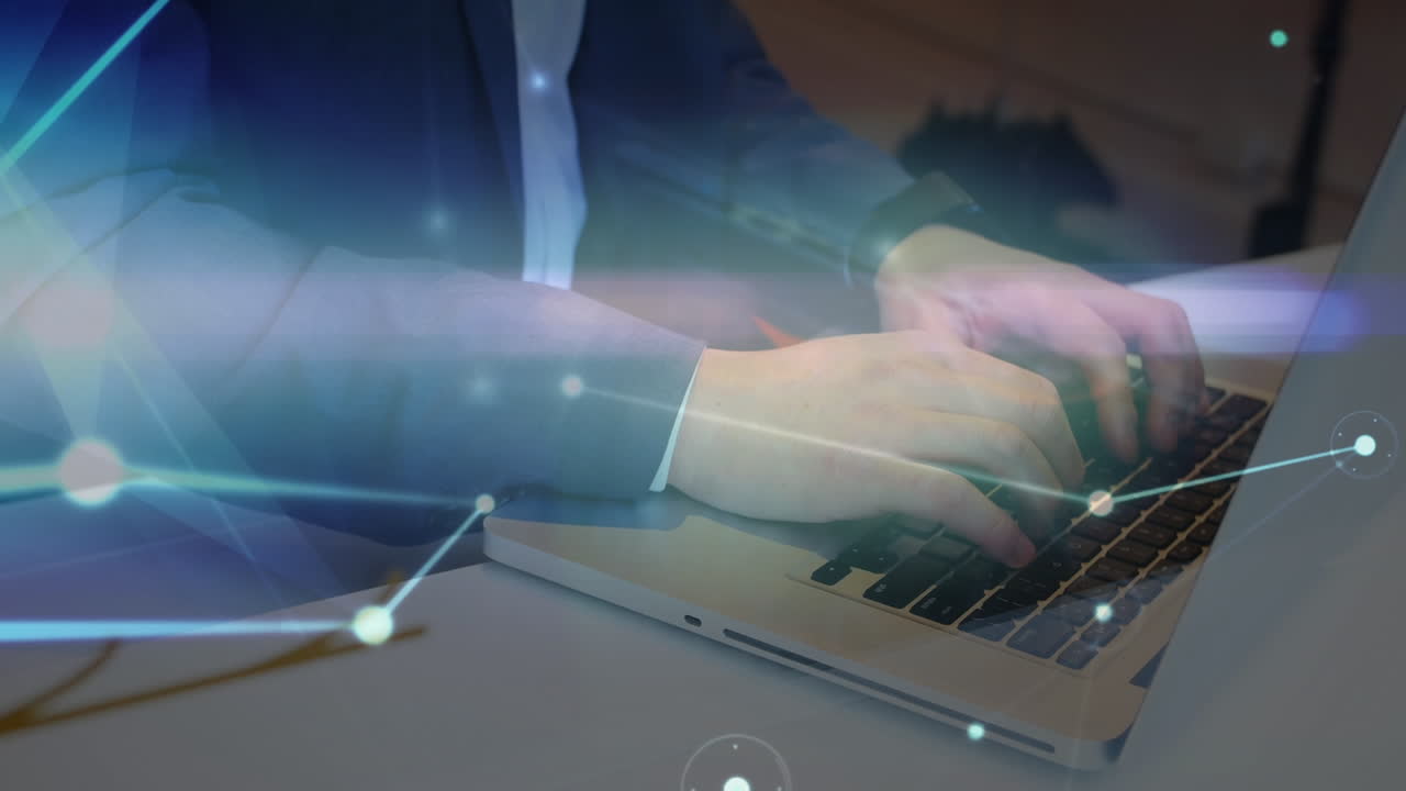 Glowing network of connections over mid section of businessman using a laptop at office