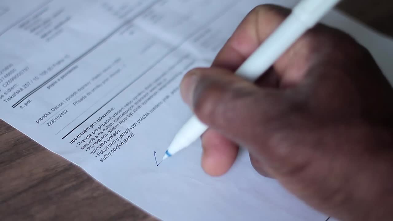 official signature on paperwork writing notes on paper in an office on a table stock video stock footage