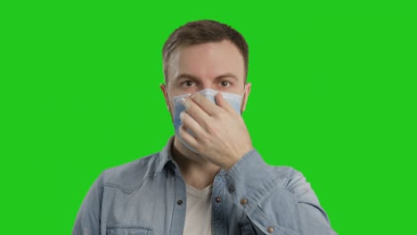 male with protective mask and thumbs up. man putting on medical flu mask