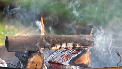 Smoke-rises-up-in-the-air-from-the-campfire