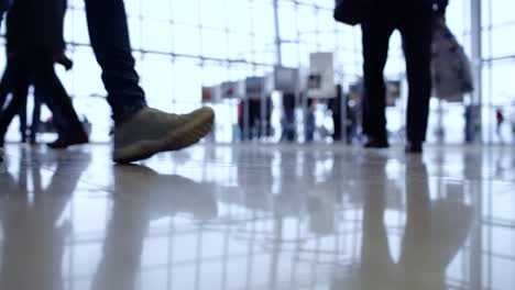 people walk inside a bright, modern building