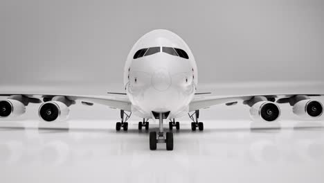 White-airplane-3D-model-on-white-background,-3D-animation,-camera-zoom-out-slowly