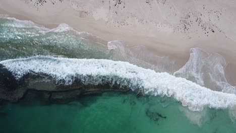 Waves-crashing-onto-sandy-coastline.Yanchep-Lagoon,-Western-Australia