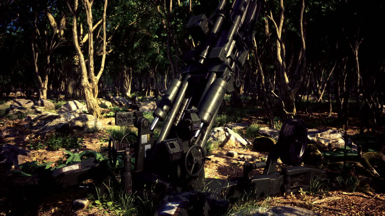 Military artillery positioned in a dense forest clearing during midday