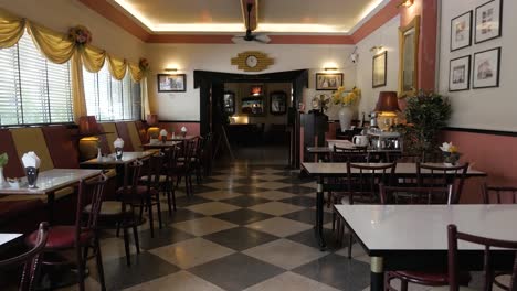 empty tables and chairs awaiting guests at atlanta hotel in bangkok