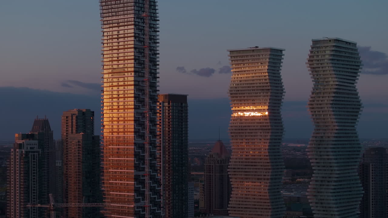 Skyline view of M City Condos in Mississauga at sunset, modern and serene