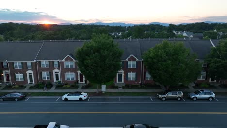 Apartment-buildings-along-quiet-road-at-night