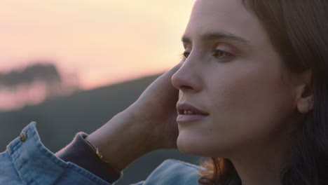 close up portrait of beautiful woman exploring spirituality looking up praying contemplating journey with wind blowing hair in countryside enjoying peaceful sunset