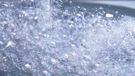 blue color bubbles macro in rotating for background and design