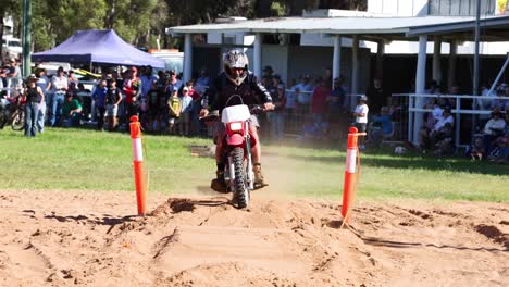 motocross rider navigates, crashes on sandy track