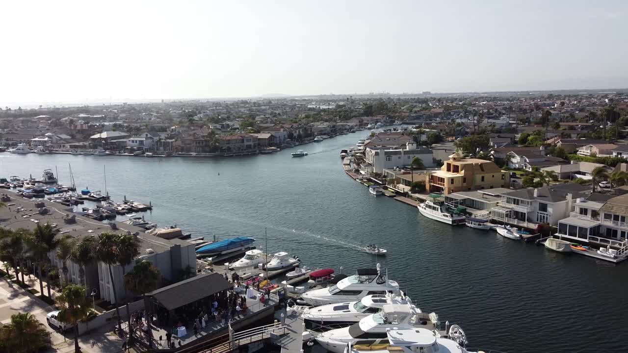 Drone View of Boats Sailing through a Marina - Overhead Truck Shot