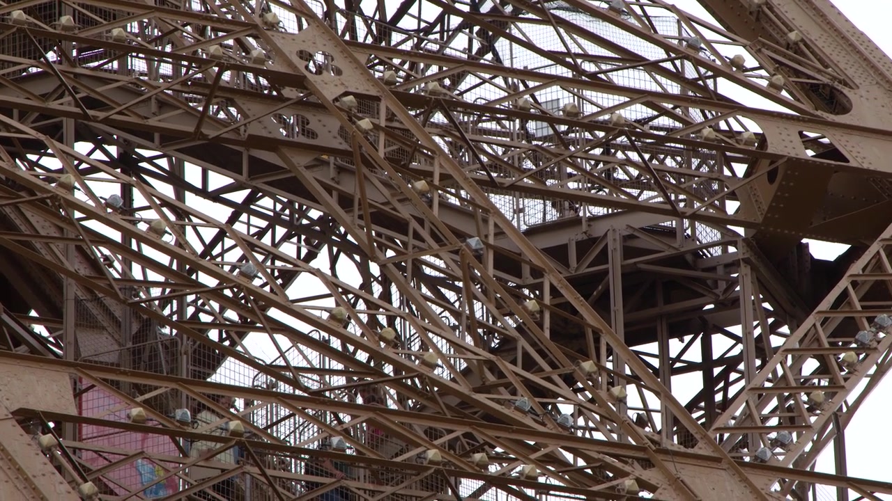 Static close up shot of complex metal girders and rivets on a famous French monument