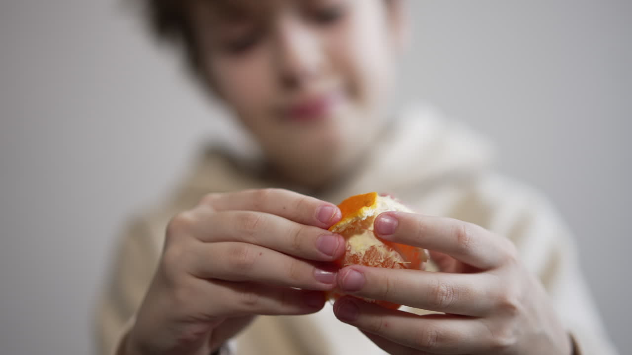 Child Peeling an Orange