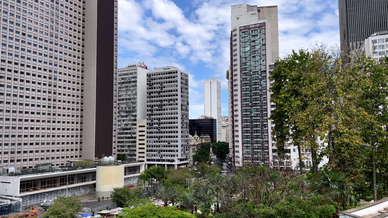A view of the dense concentration of modern and classic office towers in the central business district of Rio de Janeiro. Captures the scale of corporate life and the financial center of the city