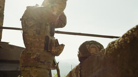 the sun shines on the young soldier preparing for war