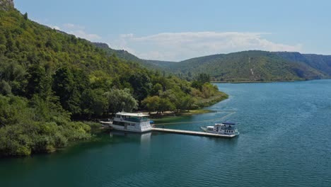 anchorage tourist boats on the port in krka national park, croatia