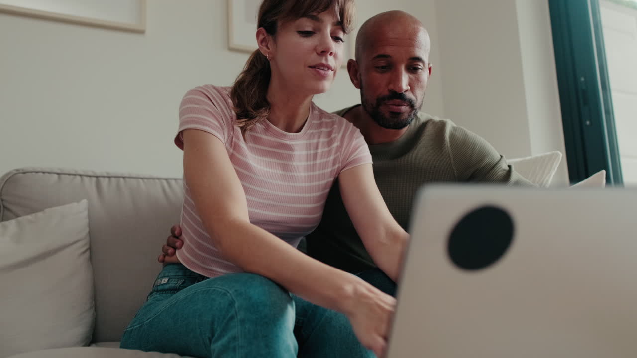 Happy Couple Browsing Laptop at Home