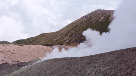 Billowing-thick-white-smoke-pouring-from-Mt-Balbi-volcano-on-tropical-island-of-Bougainville,-Papua-New-Guinea